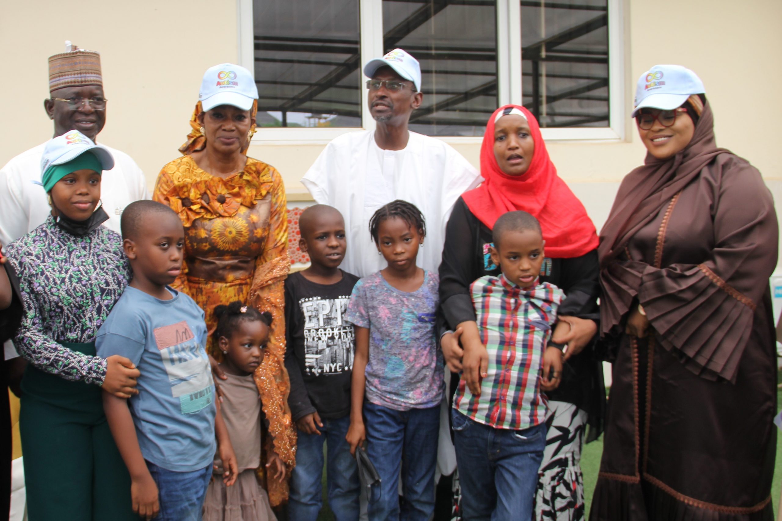  Secretary for Education Sani Dahir El-Katuzu, Special Assistant to FCT Minister on Community Relations, Dr Hailmary Aipoh, FCT Minister, Malam Muhammad Musa Bello, MD Brain Bloom Special Needs  Center Mrs Rahanatu Yusuf, Special Assistant to Minister on Community Relations, Barr. Zainab Marwa Abubakar with pupils of the Brain Bloom Center during the Minister's visit as part of Autism Awareness month in Abuja